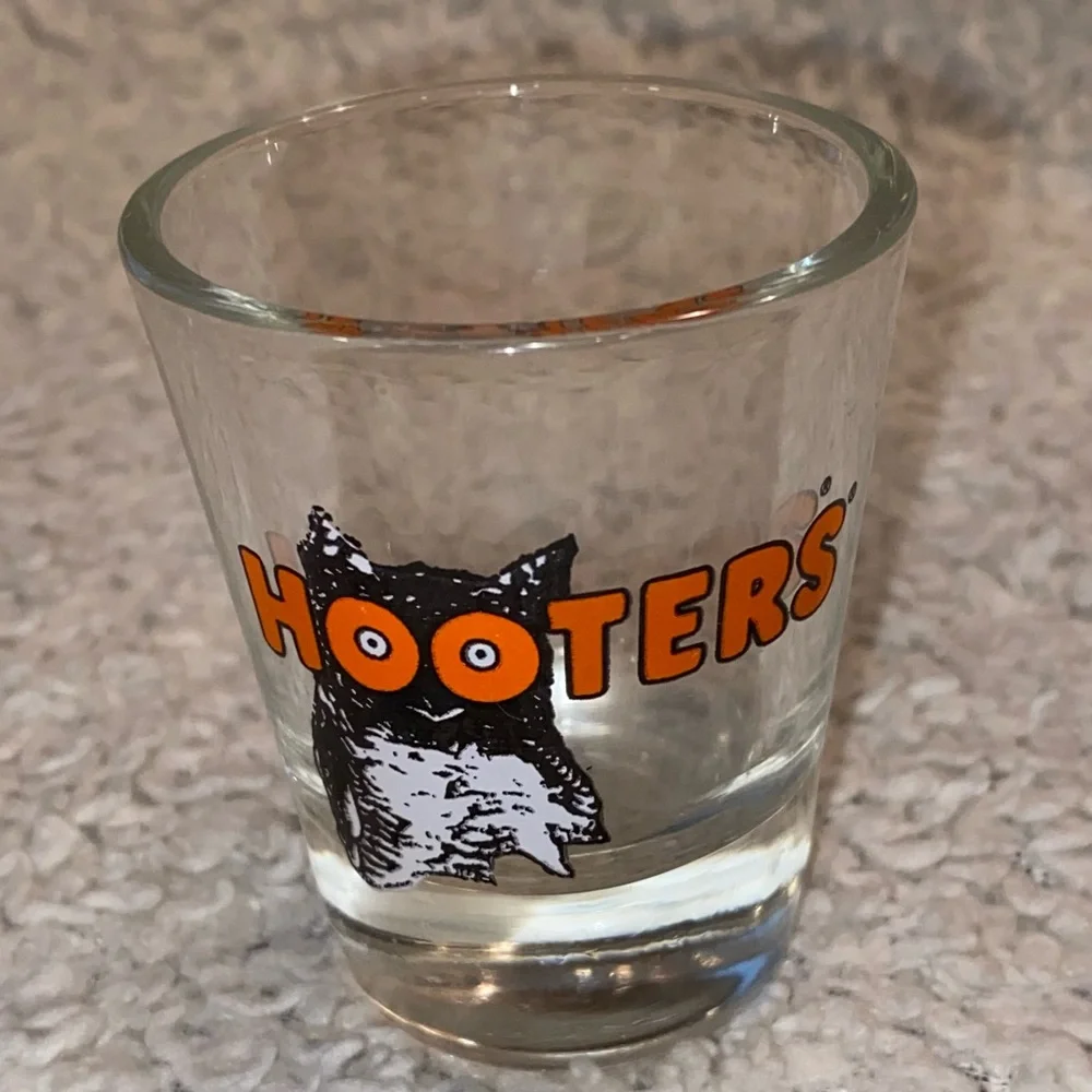 Hooter’s shot glass,  white orange with owl logo, no city specified